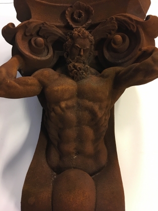 Very striking wall bracket -ornament with garing man, Polystone rest.